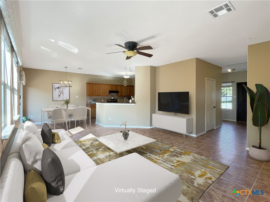 403 Red Hawk Drive Leander, TX 78641 - Photo 2 of 35 a view of a livingroom with furniture and a flat screen tv