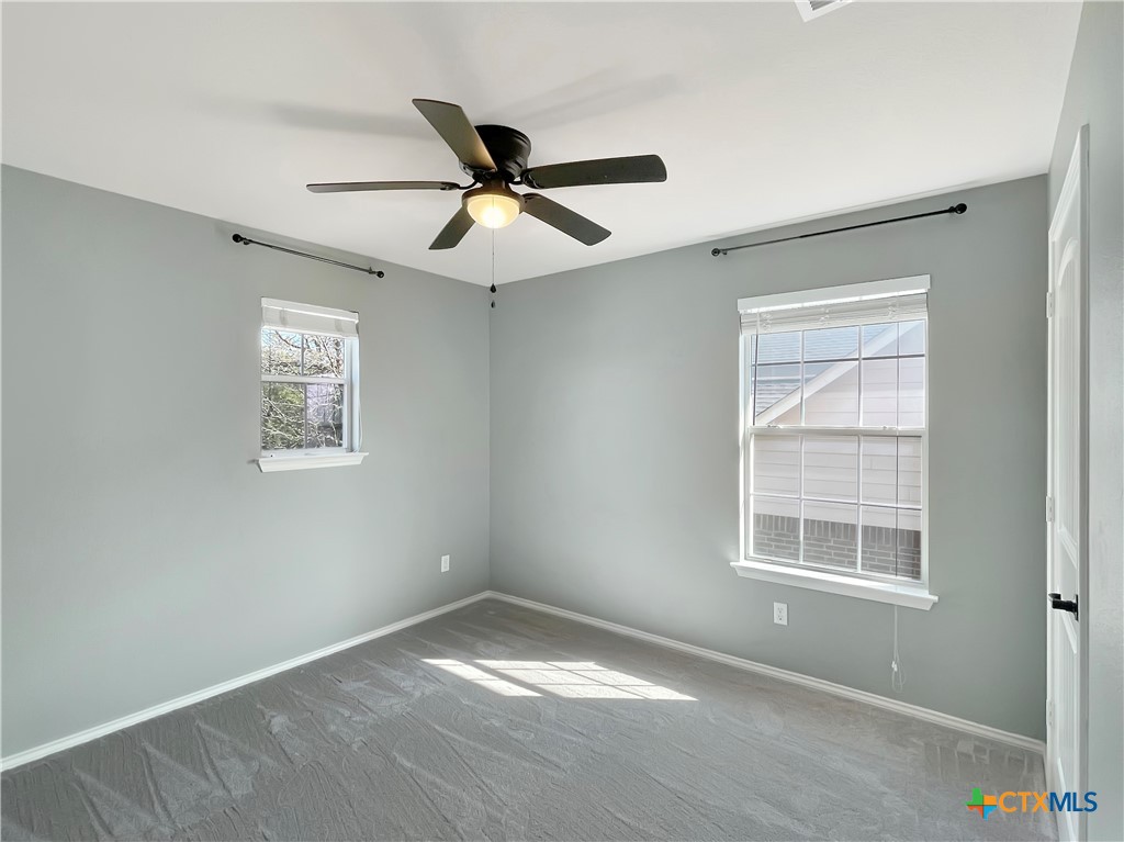 403 Red Hawk Drive Leander, TX 78641 - Photo 27 of 35 a view of empty room with windows