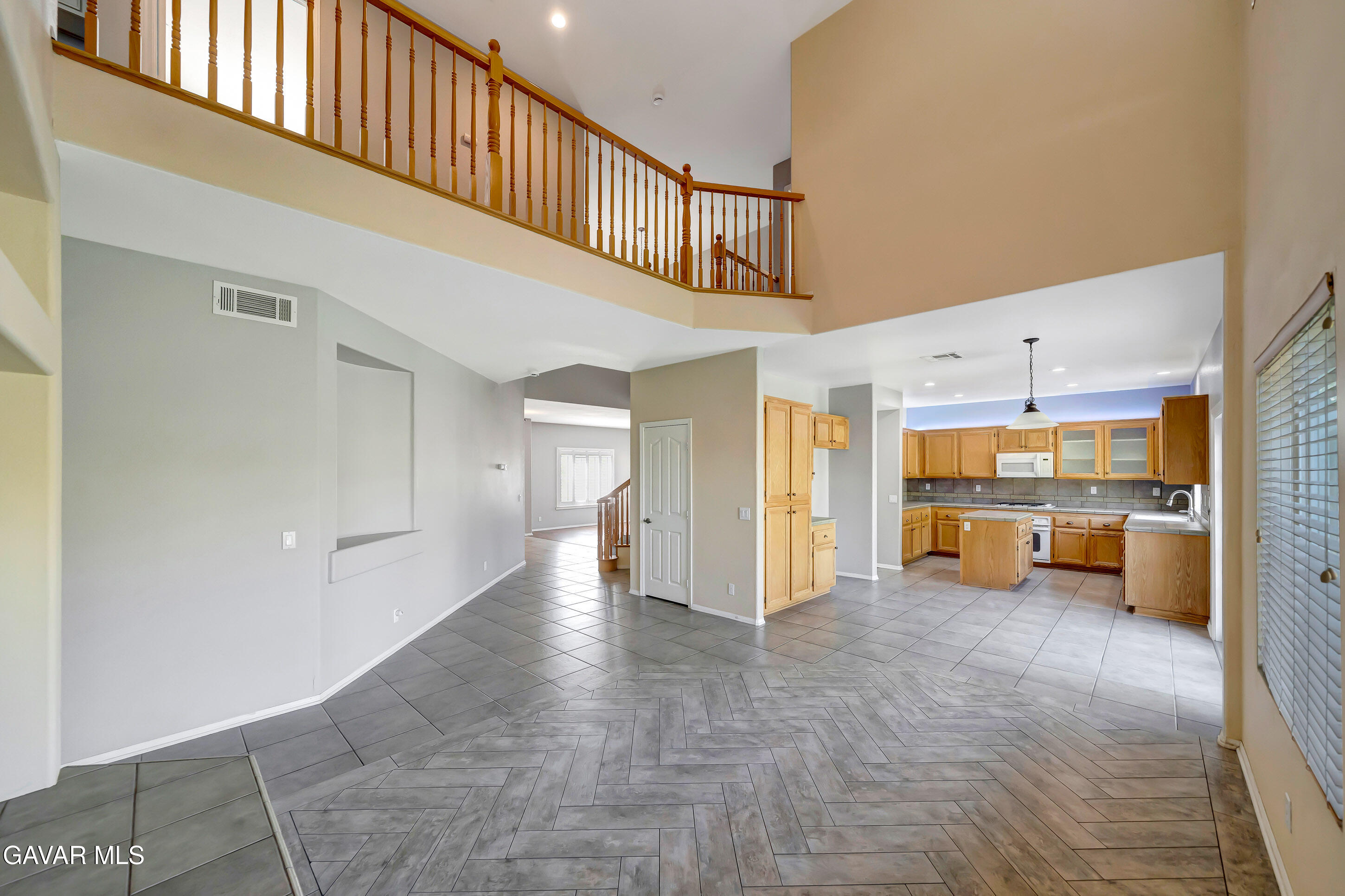 43826 Generation Avenue Lancaster, CA 93536 - Photo 17 of 61 a view of a hallway with an entryway and livingroom