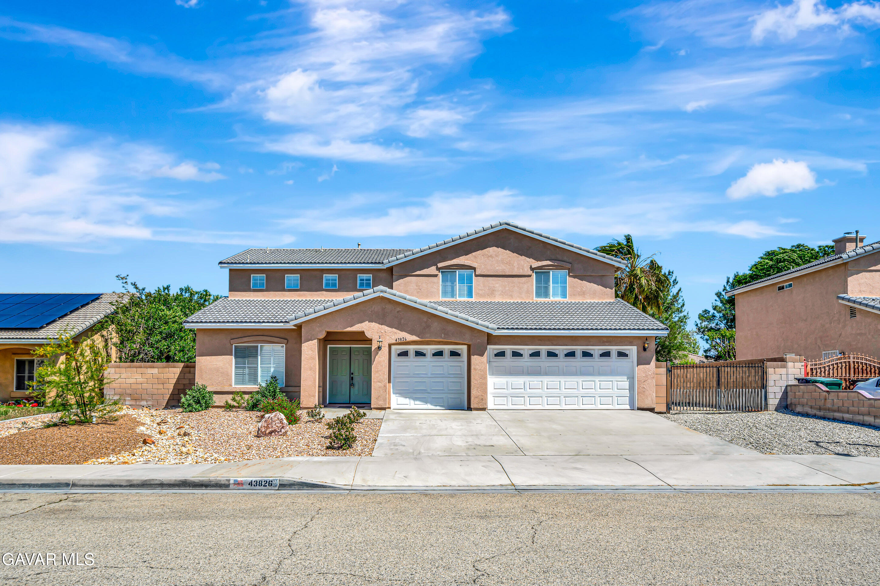 43826 Generation Avenue Lancaster, CA 93536 - Photo 2 of 61 a front view of a house with a yard