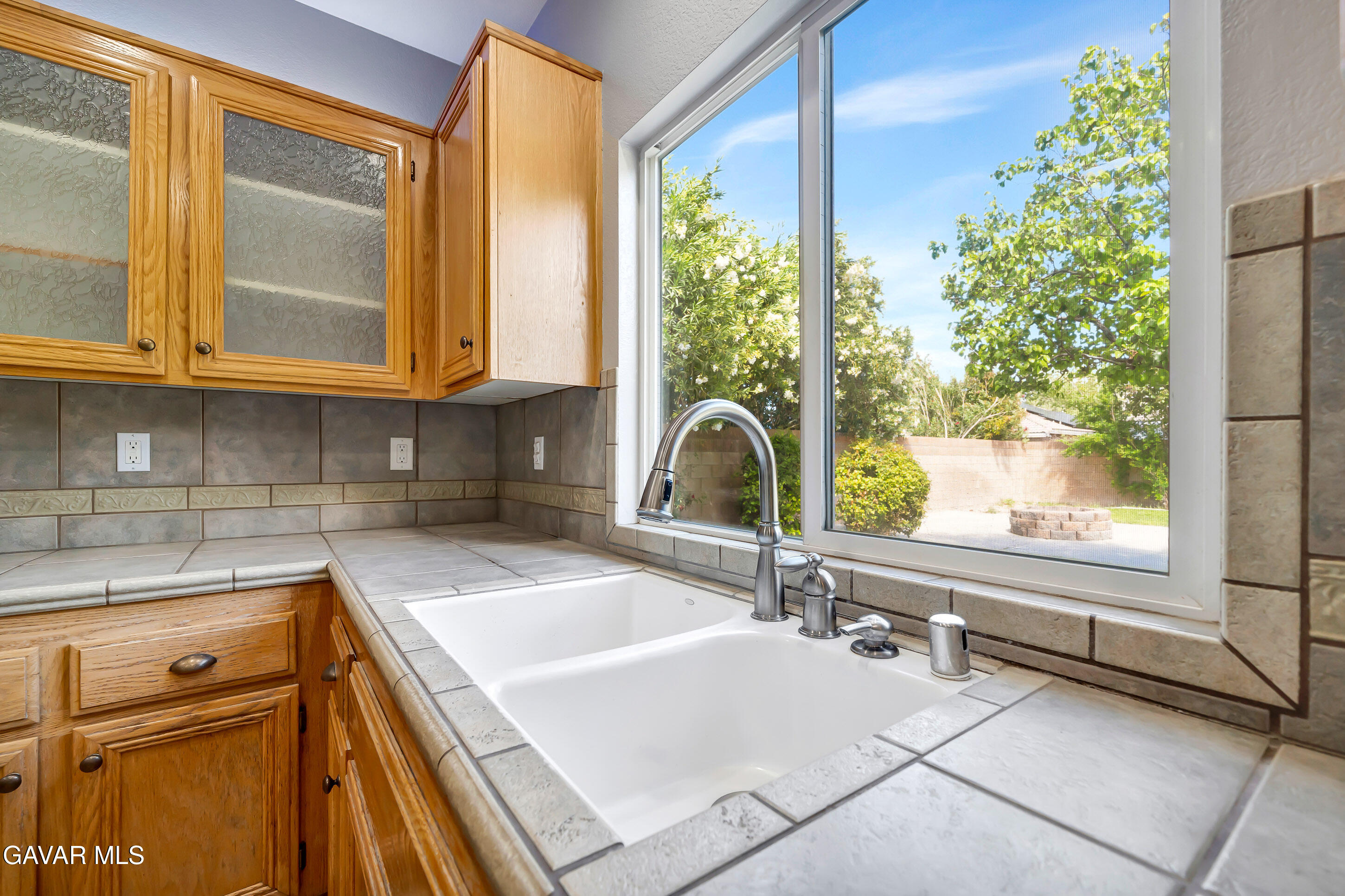 43826 Generation Avenue Lancaster, CA 93536 - Photo 24 of 61 a kitchen with a sink and a large window