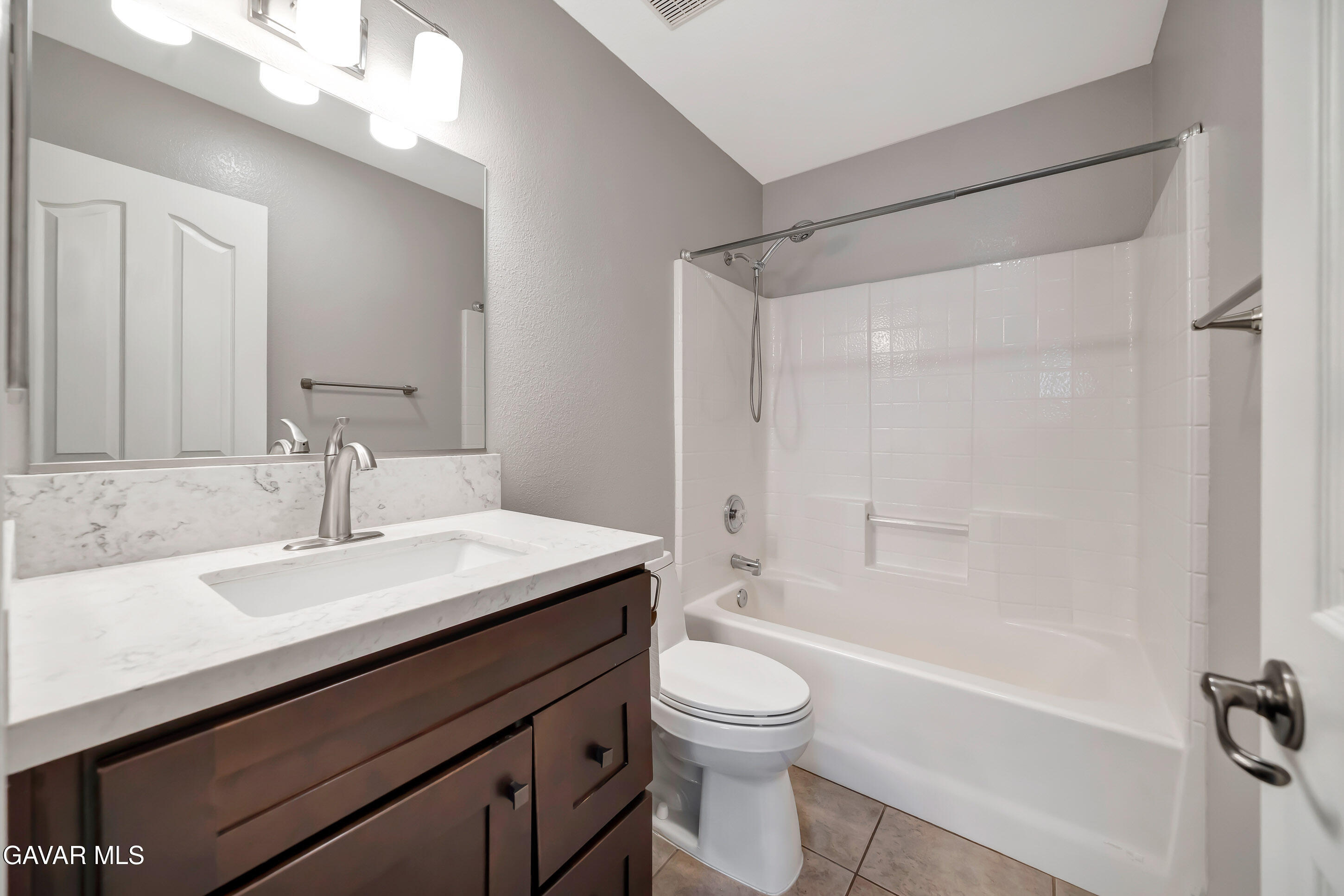43826 Generation Avenue Lancaster, CA 93536 - Photo 32 of 61 a bathroom with a sink a toilet and shower