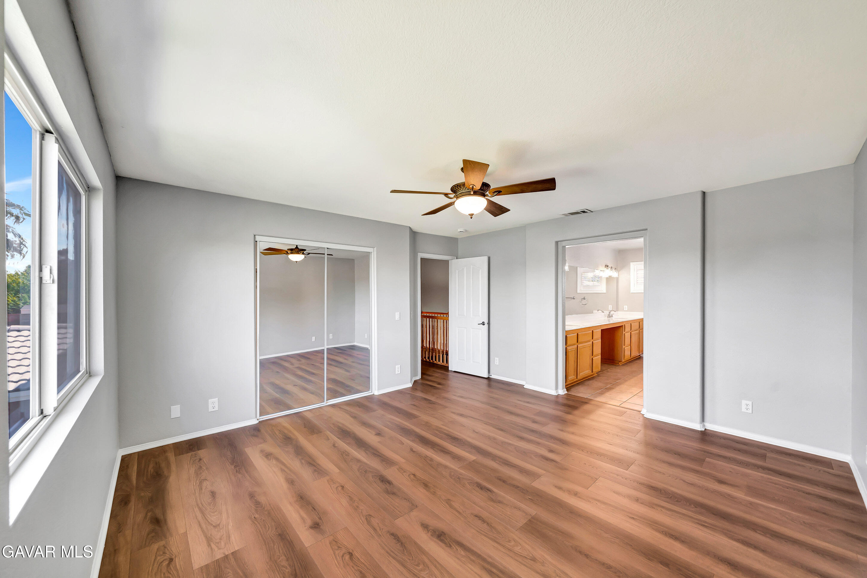 43826 Generation Avenue Lancaster, CA 93536 - Photo 40 of 61 a view of an empty room with wooden floor and a window