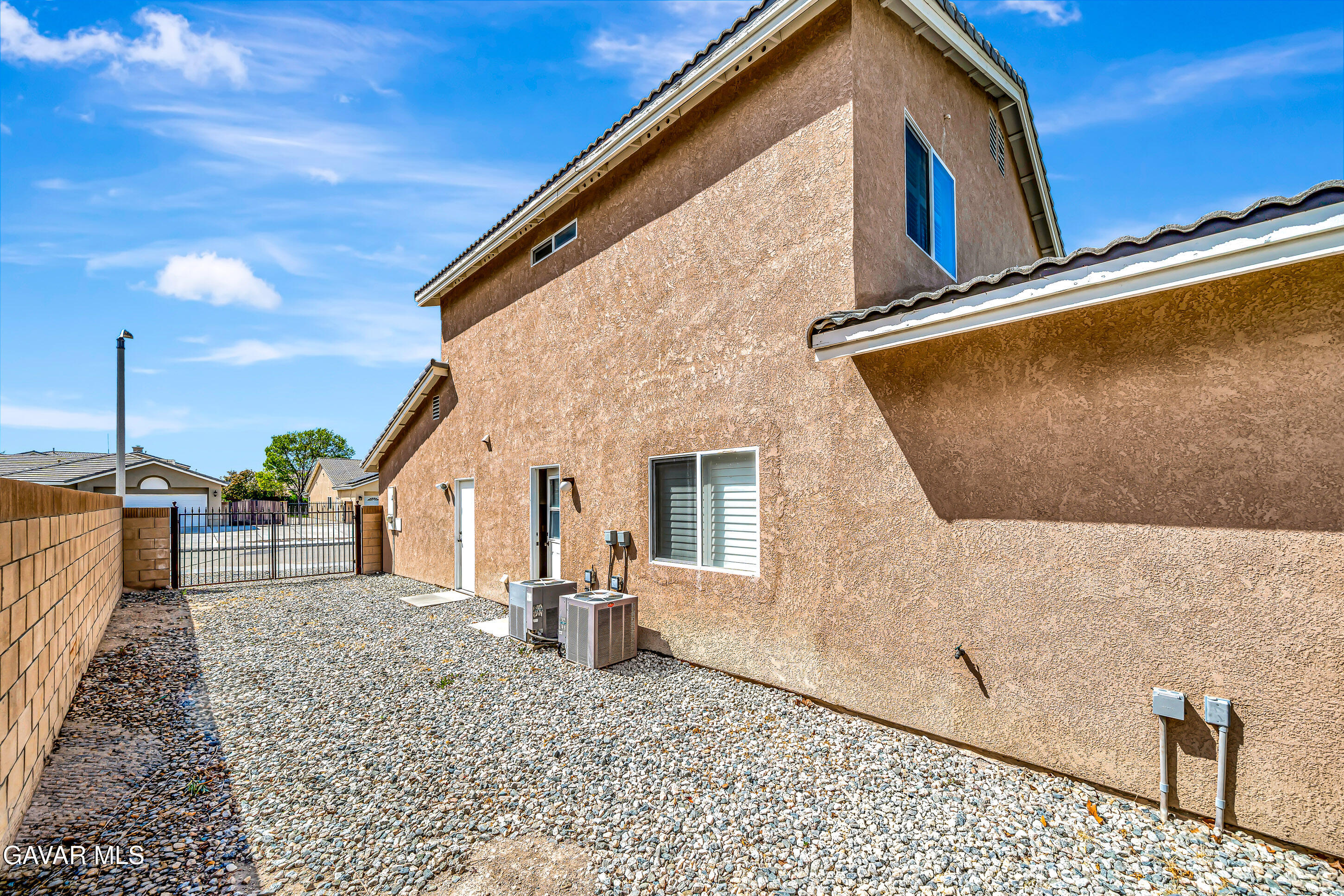 43826 Generation Avenue Lancaster, CA 93536 - Photo 4 of 61 a view of a house with a backyard