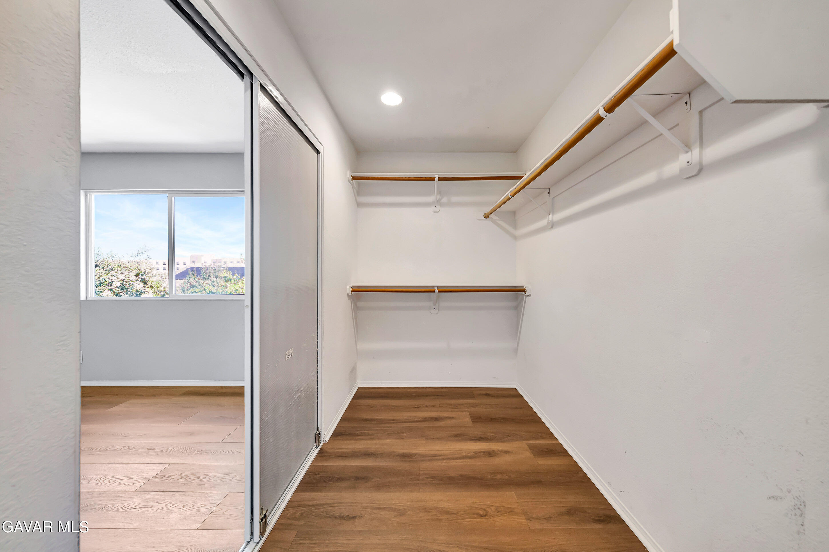 43826 Generation Avenue Lancaster, CA 93536 - Photo 41 of 61 a view of a hallway with wooden floor and staircase