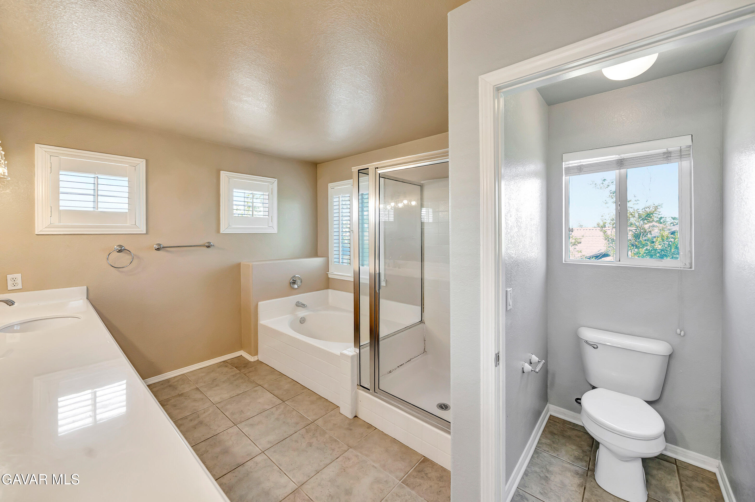 43826 Generation Avenue Lancaster, CA 93536 - Photo 43 of 61 a bathroom with a toilet sink and a shower