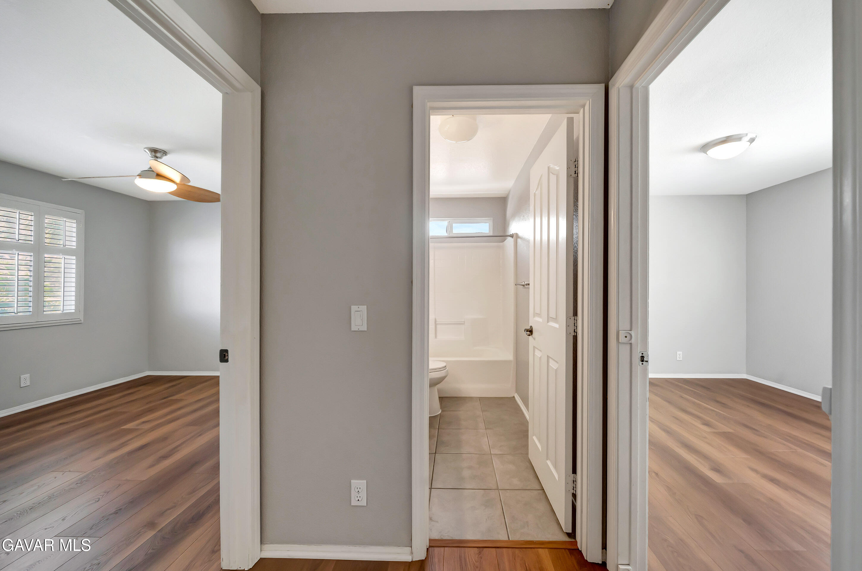 43826 Generation Avenue Lancaster, CA 93536 - Photo 50 of 61 a view of a room with wooden floor mirror and windows