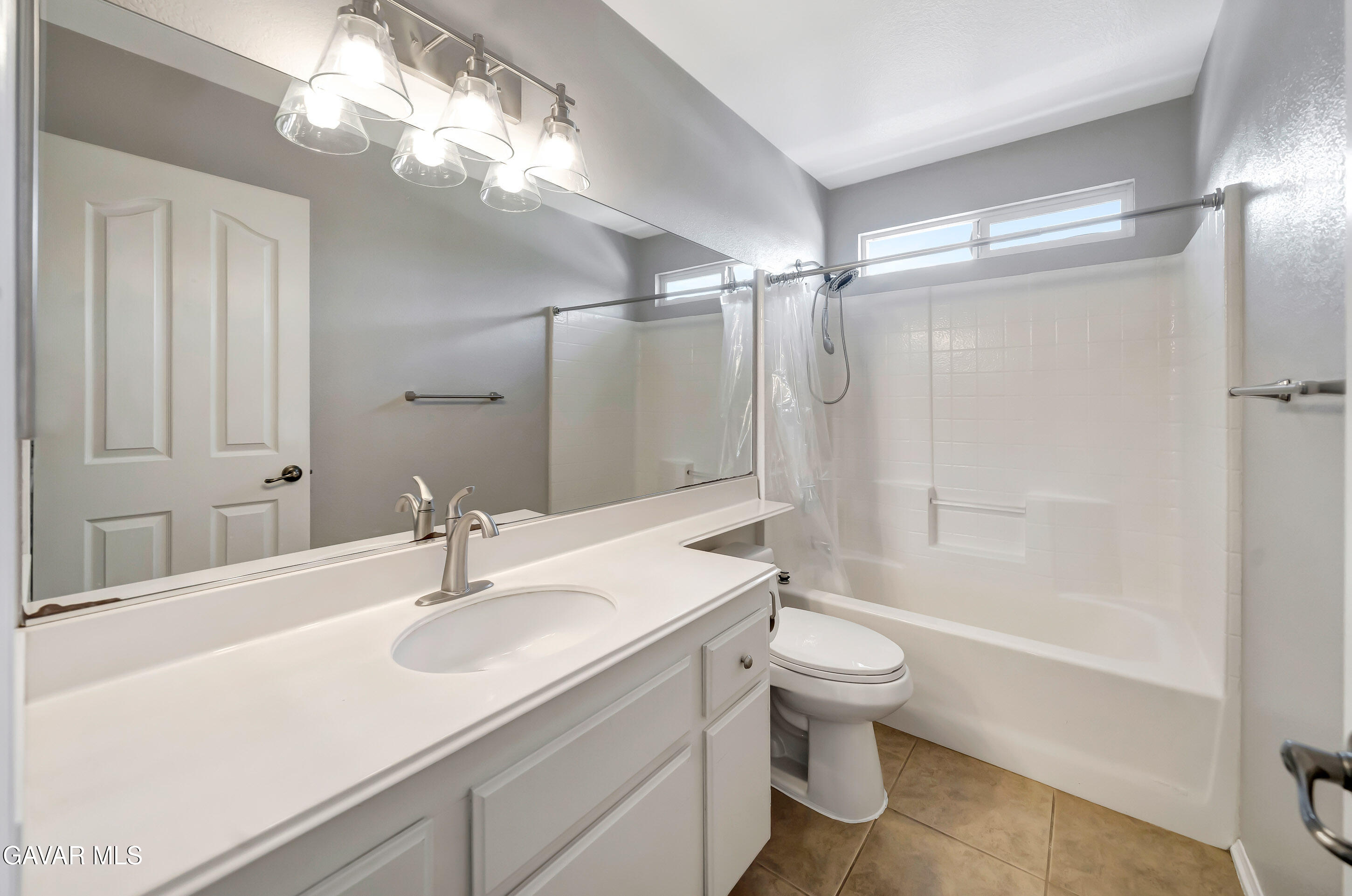 43826 Generation Avenue Lancaster, CA 93536 - Photo 51 of 61 a bathroom with a sink a toilet a mirror and a shower