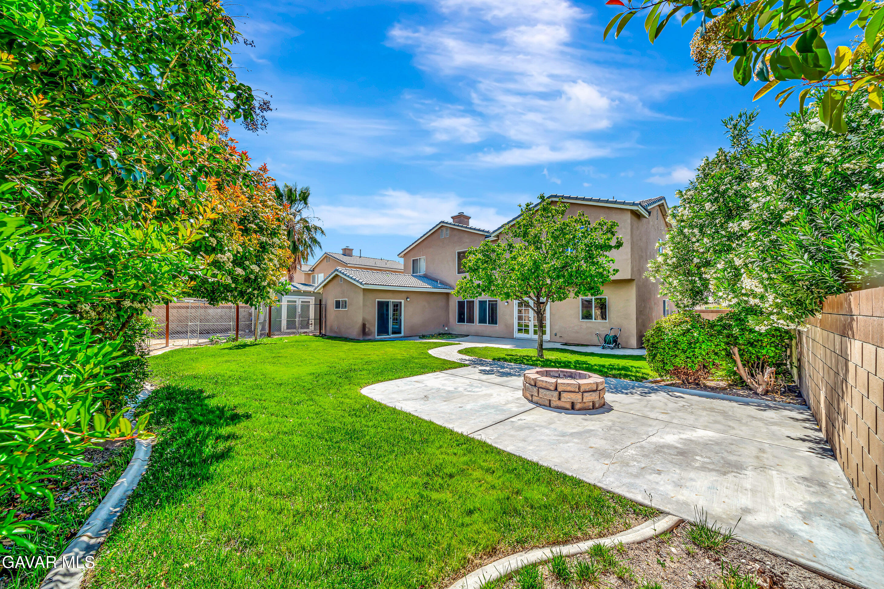 43826 Generation Avenue Lancaster, CA 93536 - Photo 55 of 61 a front view of a house with a garden