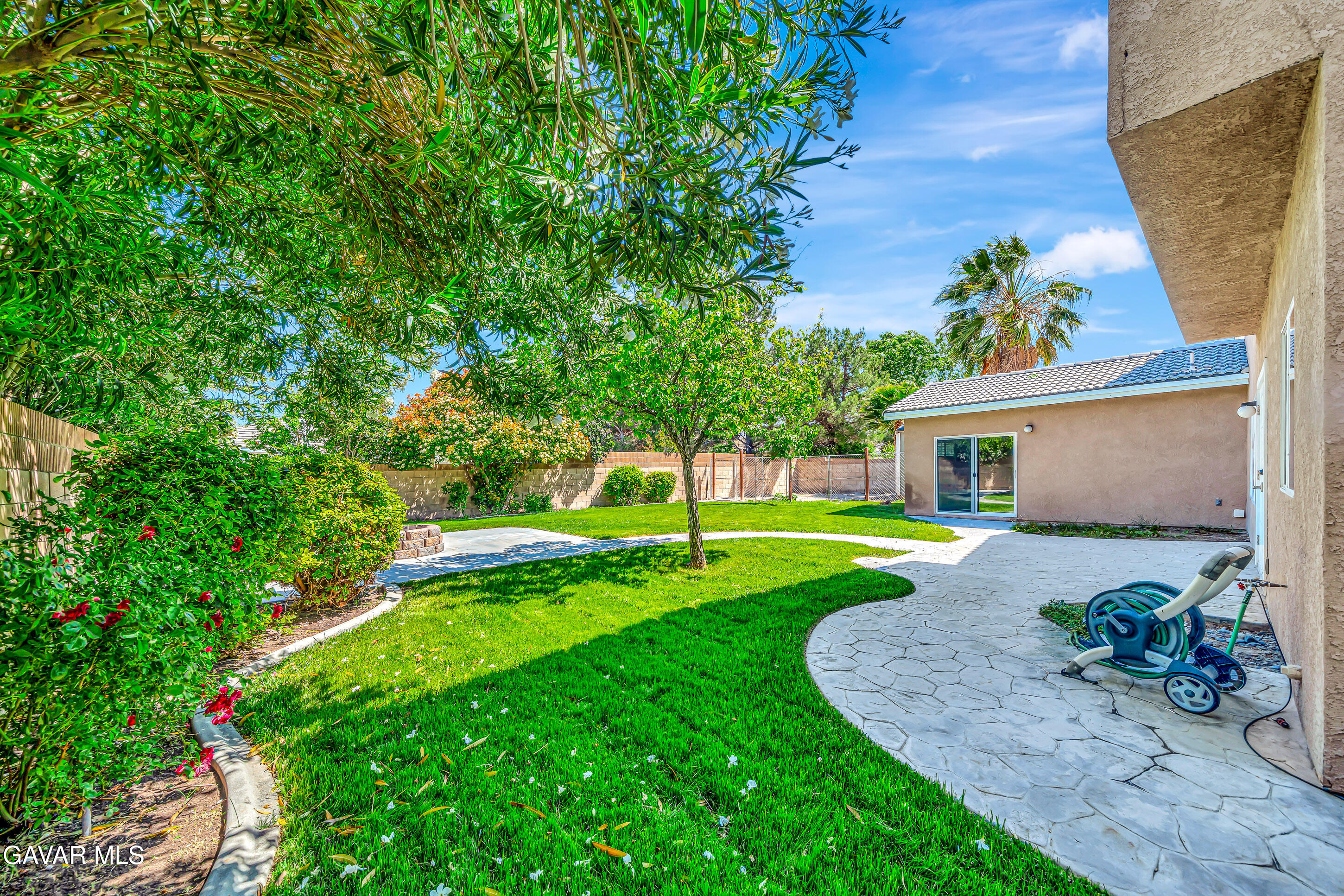 43826 Generation Avenue Lancaster, CA 93536 - Photo 56 of 61 a view of a house with backyard sitting area and garden