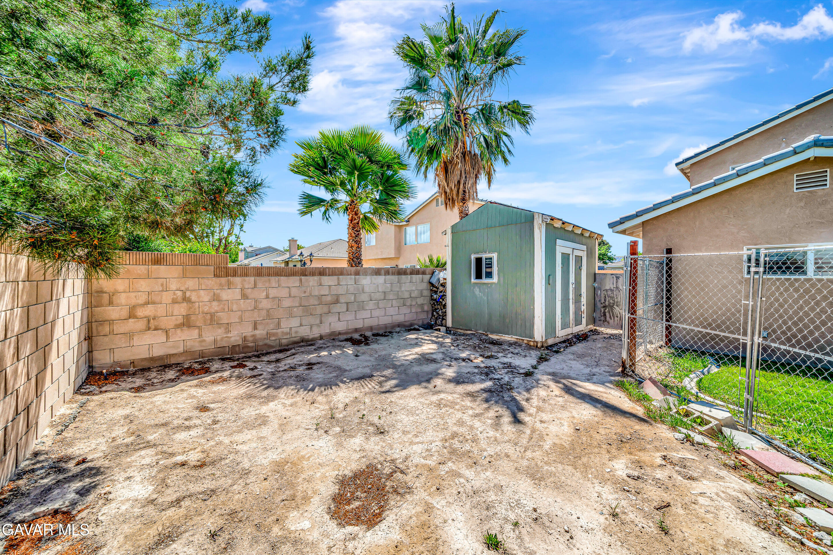43826 Generation Avenue Lancaster, CA 93536 - Photo 59 of 61 a front view of a house with a yard and garage