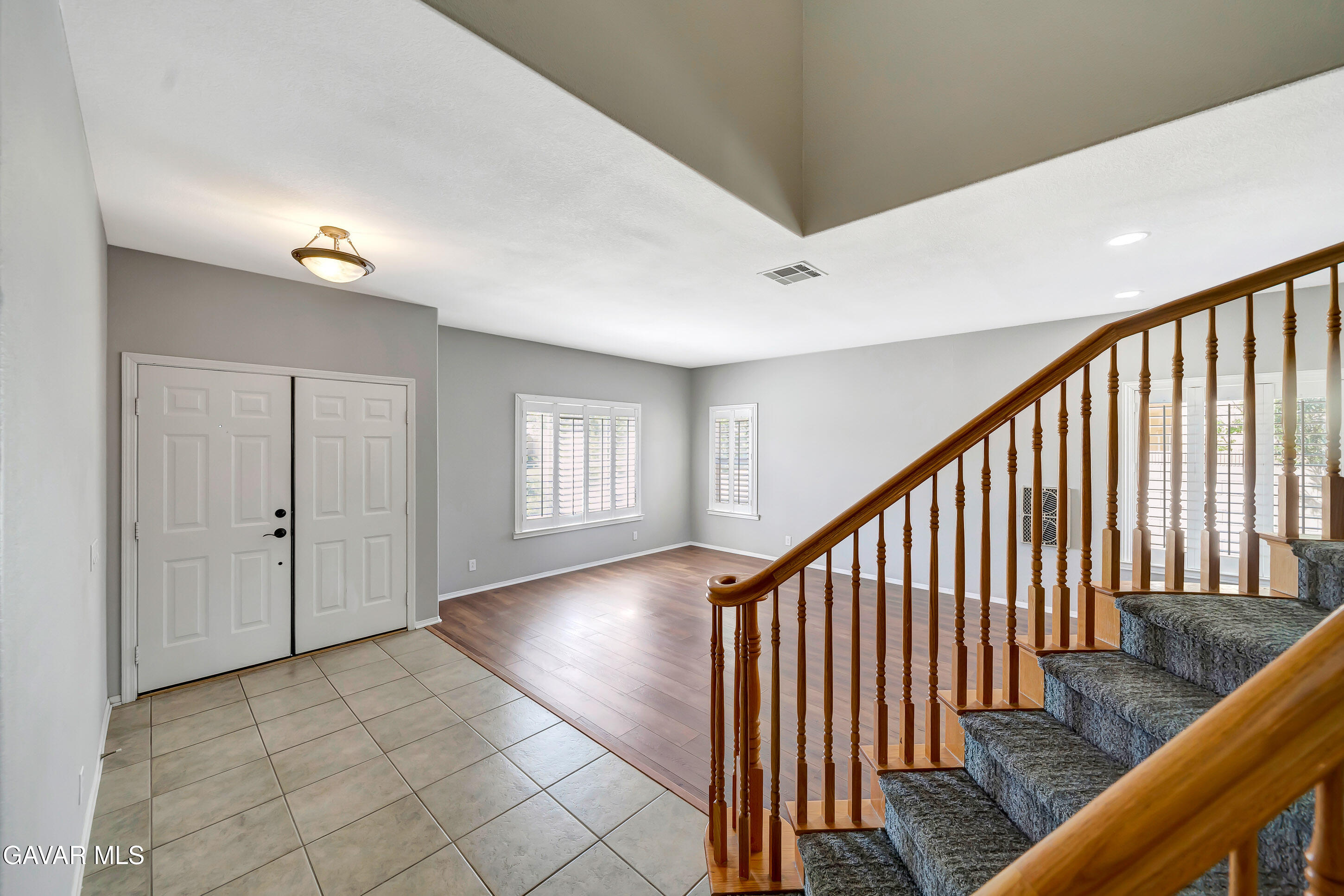 43826 Generation Avenue Lancaster, CA 93536 - Photo 8 of 61 a view of staircase with wooden floor and fan