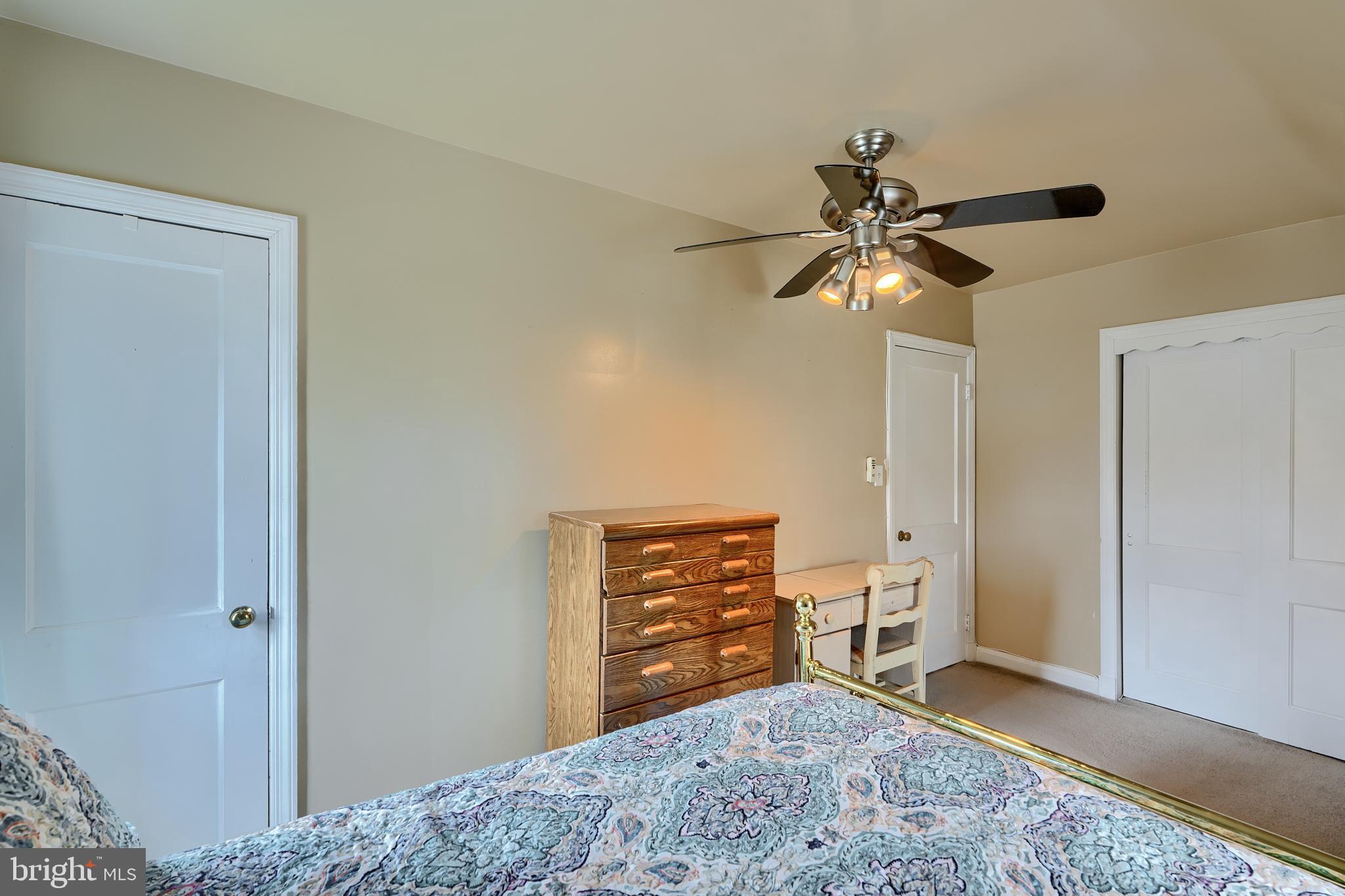297 Hazel Avenue Baltimore, MD 21227 - Photo 28 of 56 a view of room with window and a ceiling fan