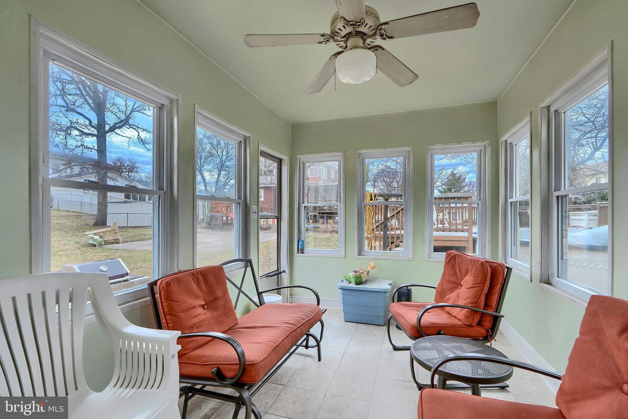 297 Hazel Avenue Baltimore, MD 21227 - Photo 37 of 56 a living room with furniture and a large window