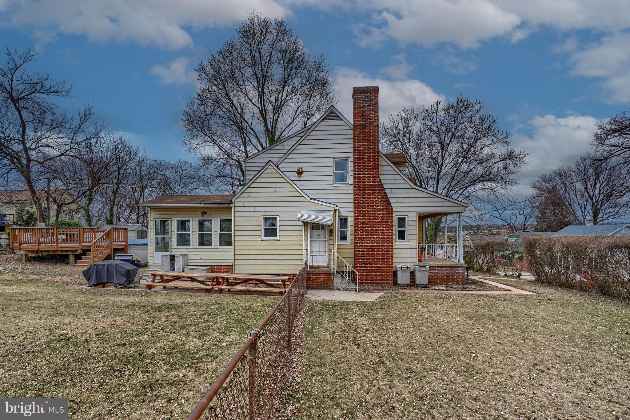 297 Hazel Avenue Baltimore, MD 21227 - Photo 50 of 56 a view of a house with a yard covered in snow