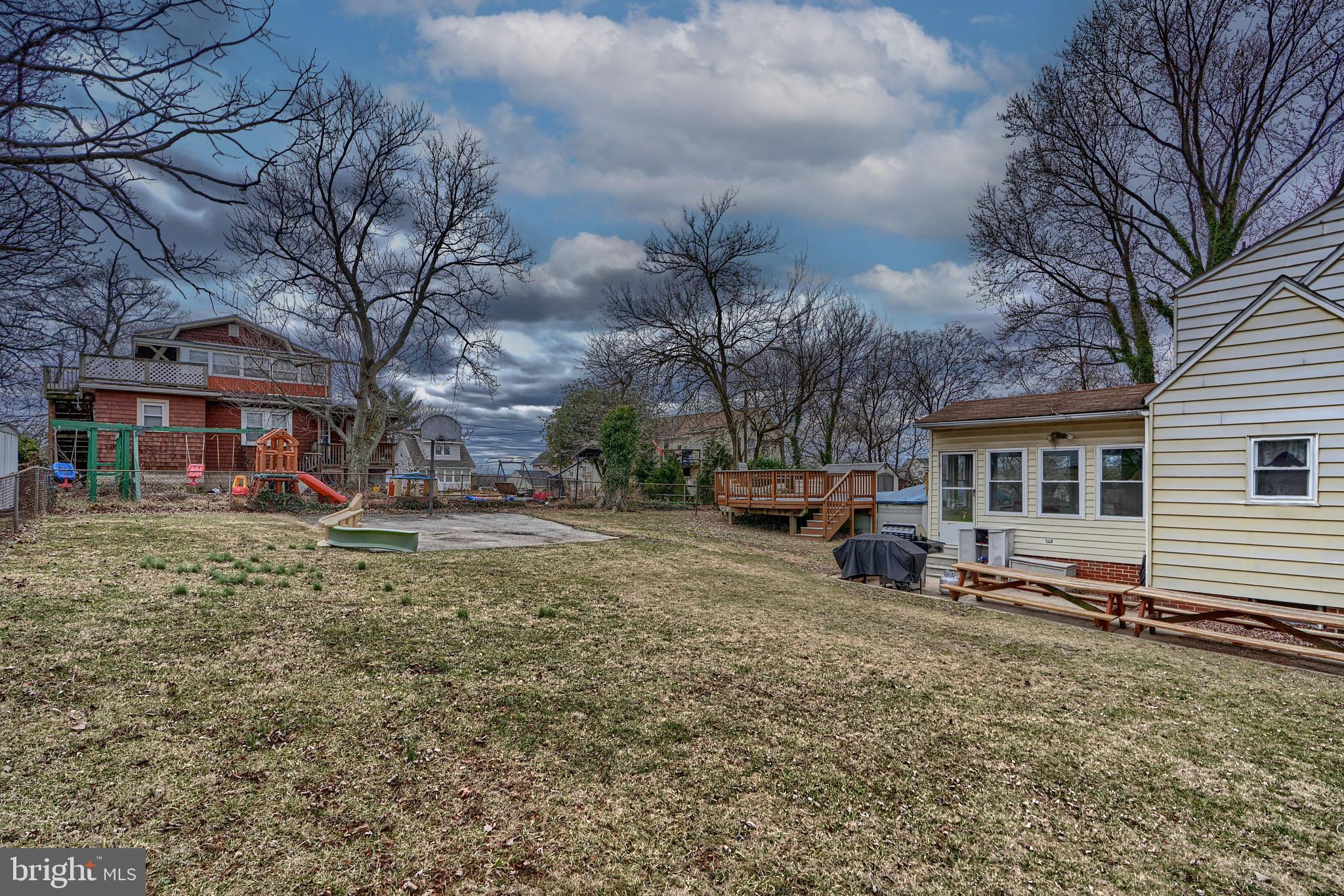 297 Hazel Avenue Baltimore, MD 21227 - Photo 51 of 56 a view of a house with a yard covered in snow