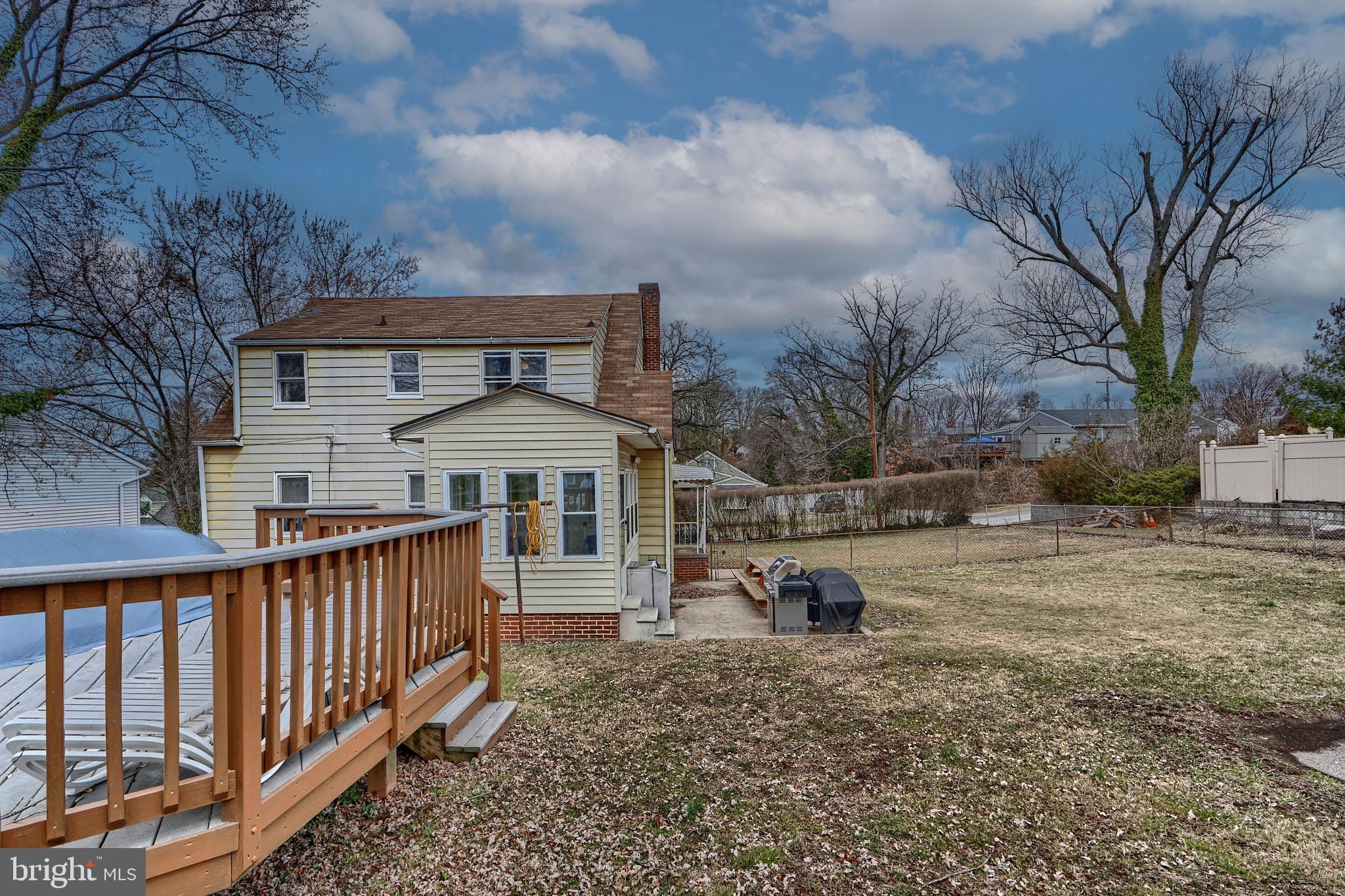 297 Hazel Avenue Baltimore, MD 21227 - Photo 56 of 56 a front view of a house with a yard