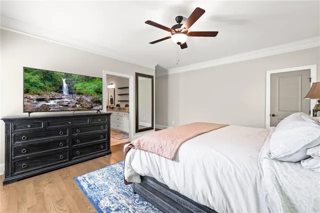 a bedroom with a large bed rug and a window