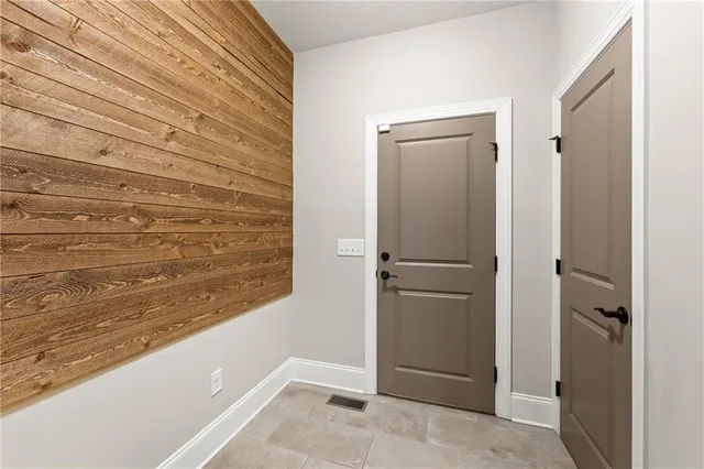 a bedroom with a bed chair and window