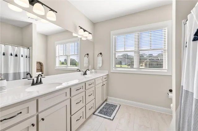 a bedroom with a bed and a lamp