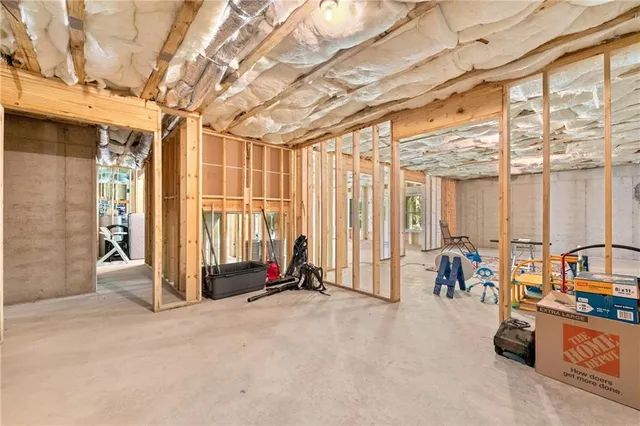 a view of a house with wooden fence