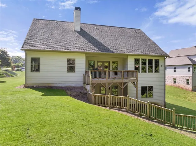 a view of house with yard