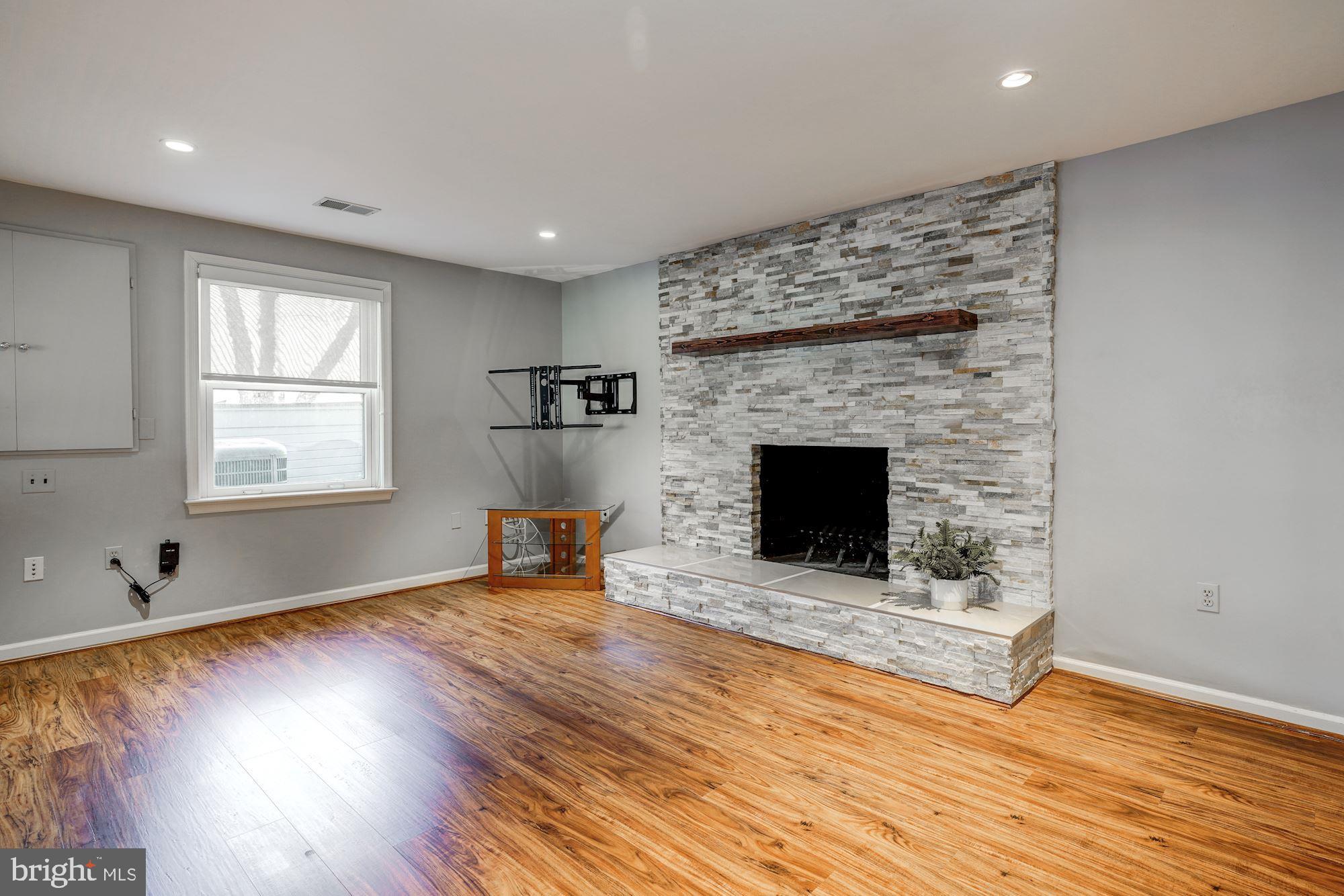 2008 Roundhouse Road Vienna, VA 22181 - Photo 48 of 71 Sitting area of rec rm w/ wood buring fireplace