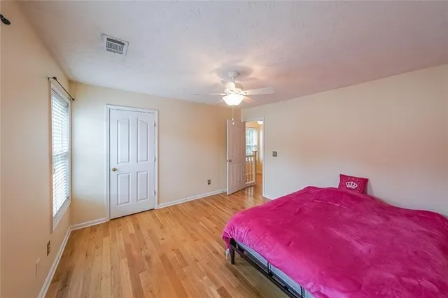 a bed room with a bed and a chandelier