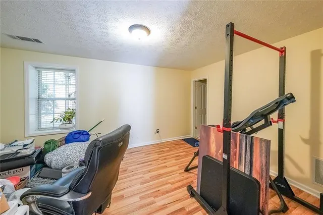 a bedroom with furniture and a window