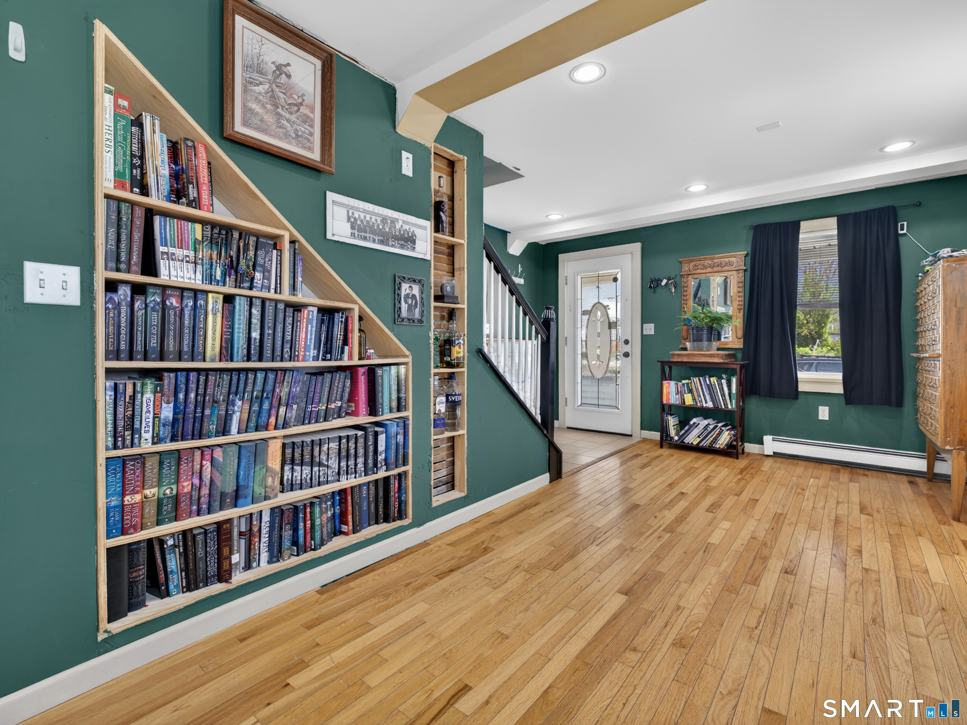 13 Oak Street Groton, CT 06340 - Photo 5 of 38 a view of an empty room with lots of furniture and staircase
