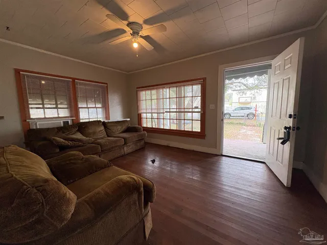a living room with furniture and a window