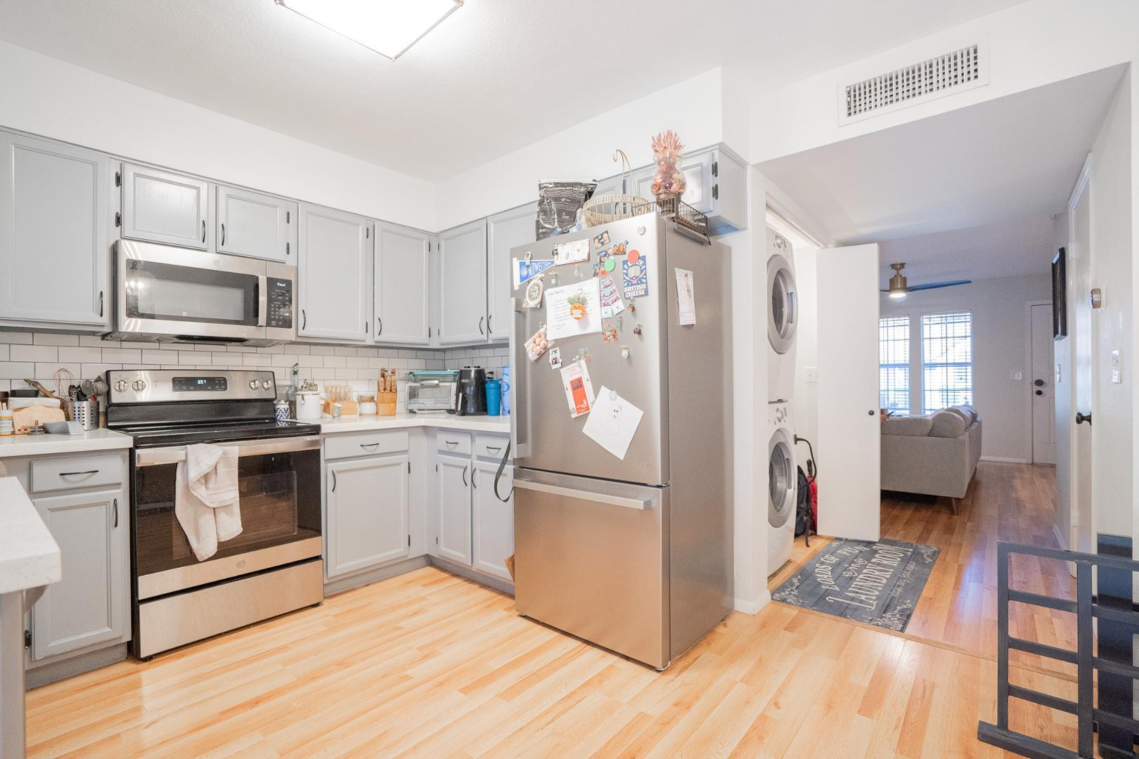 8111 West Wacker Road, Unit 70 Peoria, AZ 85381 - Photo 10 of 38 a kitchen with stainless steel appliances a refrigerator stove and sink