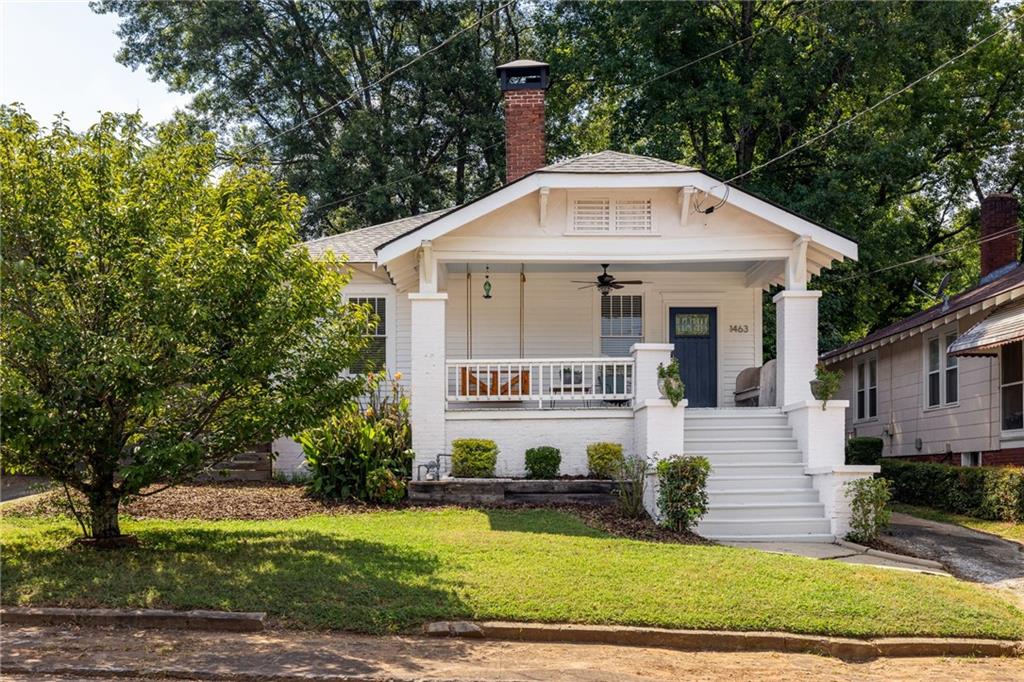 1463 Graham Street Southwest Atlanta, GA 30310 - Photo 1 of 1 a front view of a house with a yard