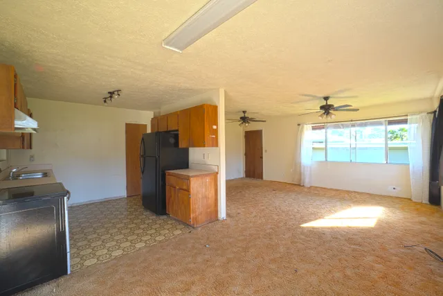 a view of a kitchen with furniture and a kitchen