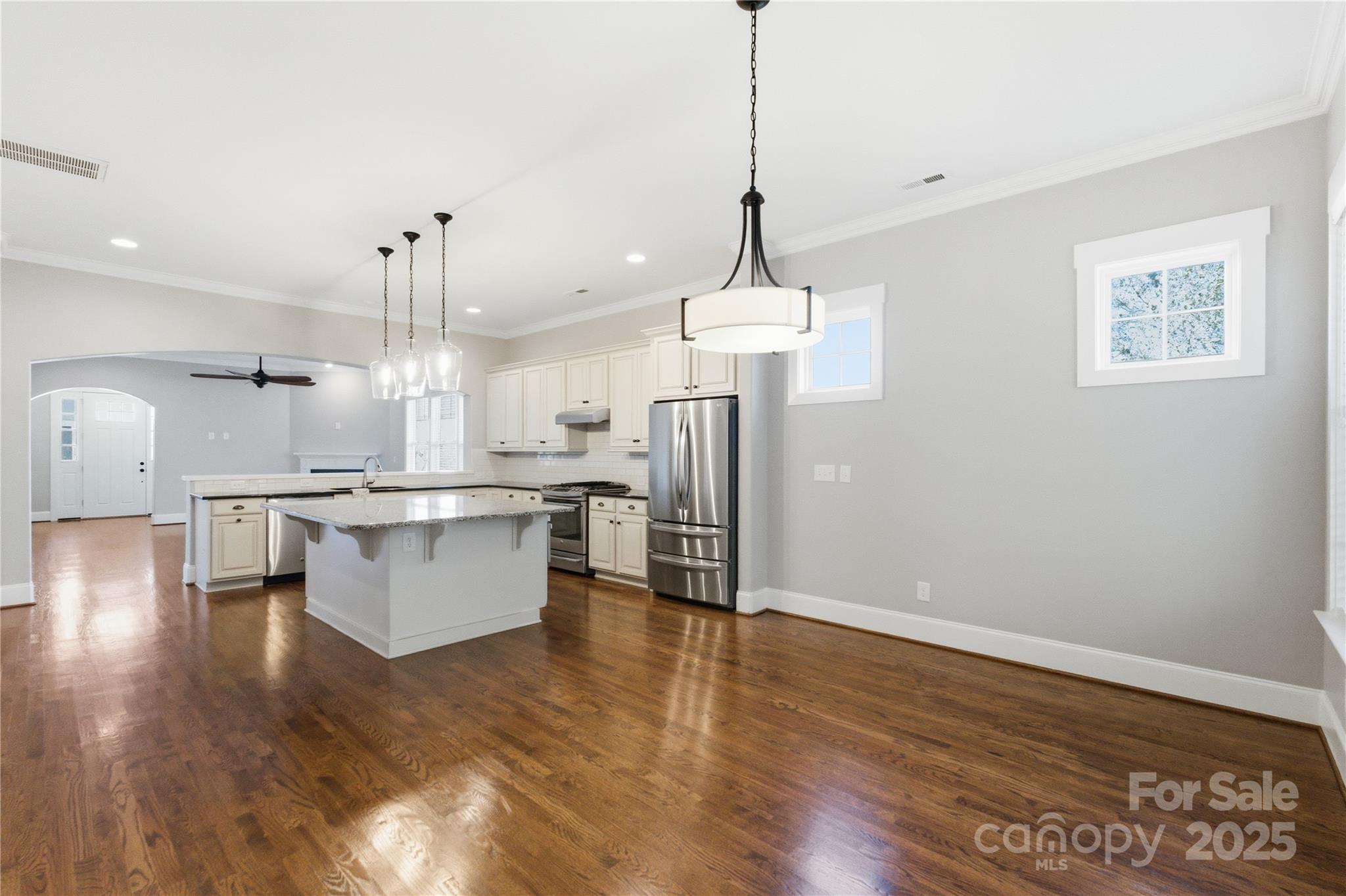 743 Bluff Loop Road Rock Hill, SC 29730 - Photo 12 of 37 a view of a kitchen with a sink a refrigerator and wooden floor