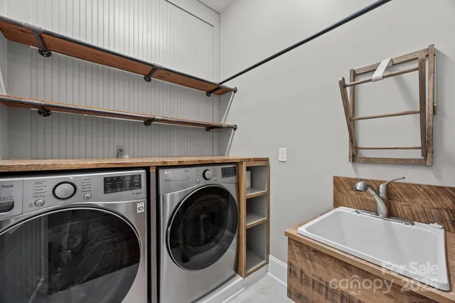 an empty room with a window and a ceiling fan