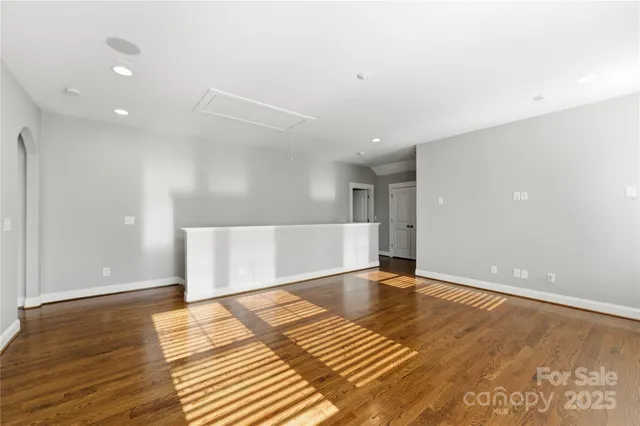 a view of a house with a yard patio and a small yard