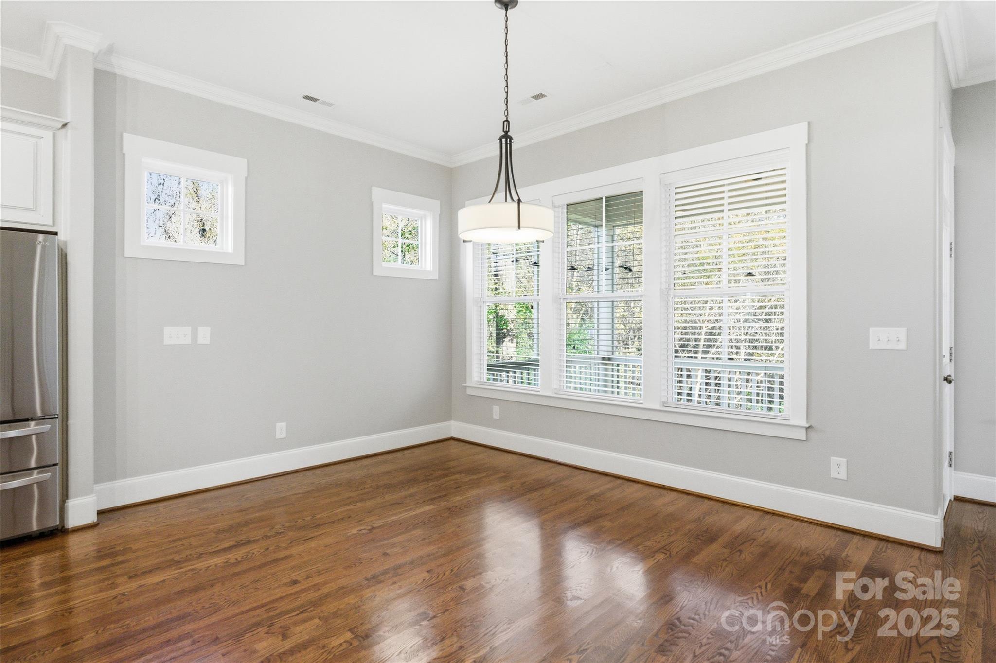 743 Bluff Loop Road Rock Hill, SC 29730 - Photo 6 of 37 a view of an empty room with a window and wooden floor