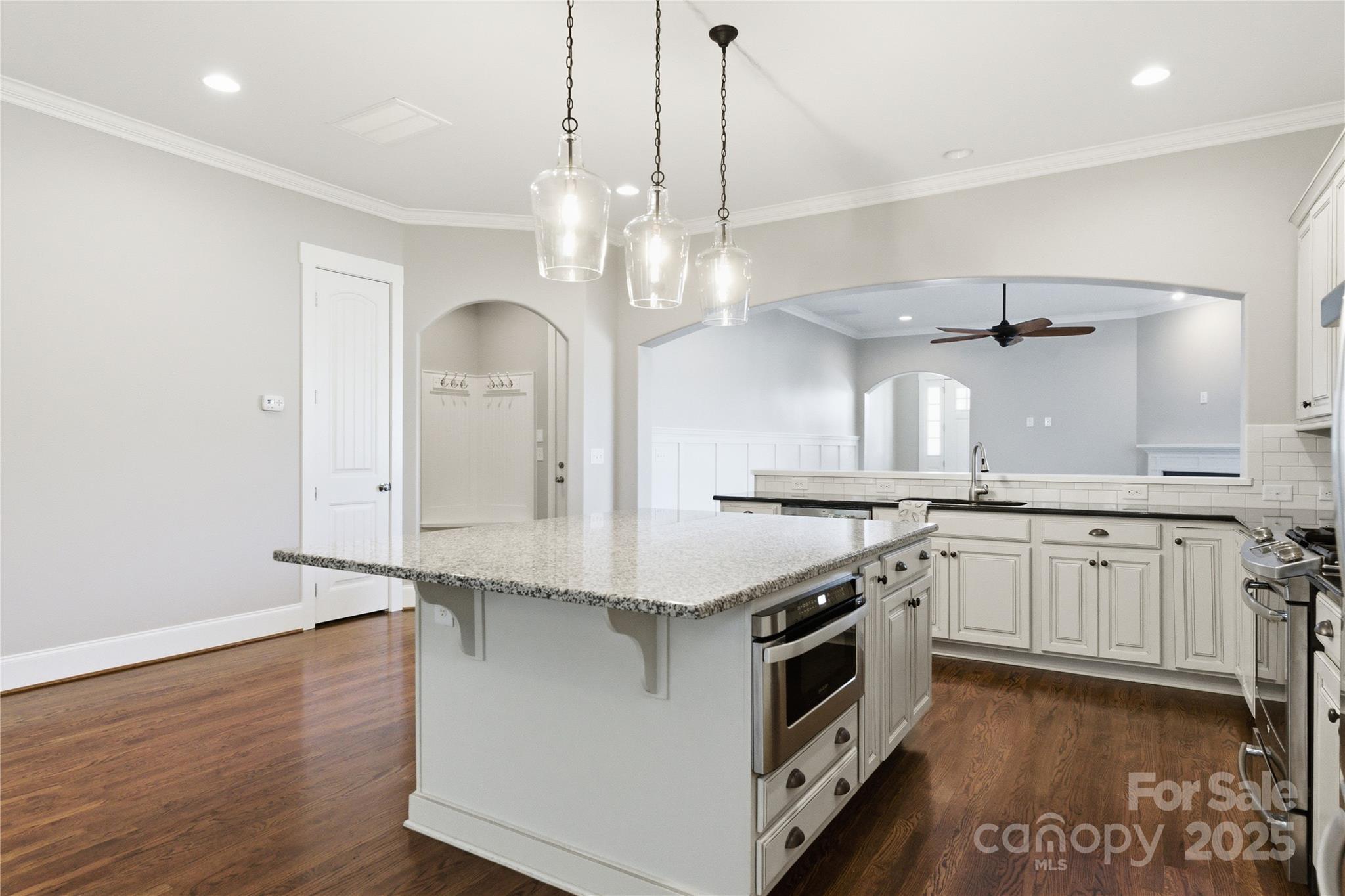 743 Bluff Loop Road Rock Hill, SC 29730 - Photo 7 of 37 a kitchen with stainless steel appliances granite countertop a stove a sink and a chandelier