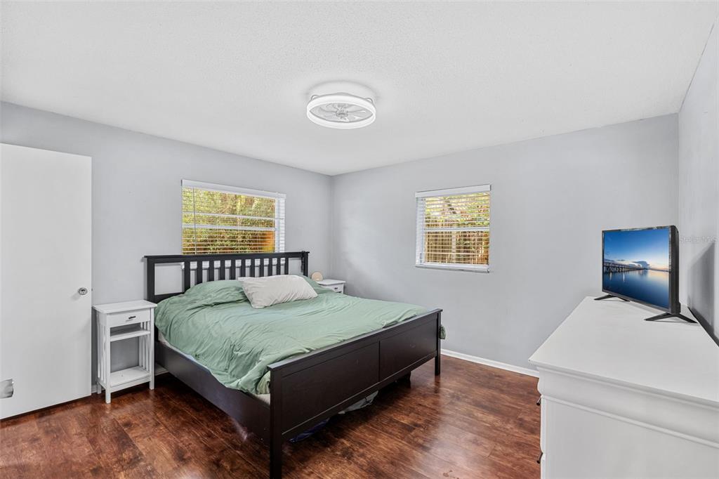 2923 Conway Gardens Road Orlando, FL 32806 - Photo 12 of 28 a bedroom with a bed and window