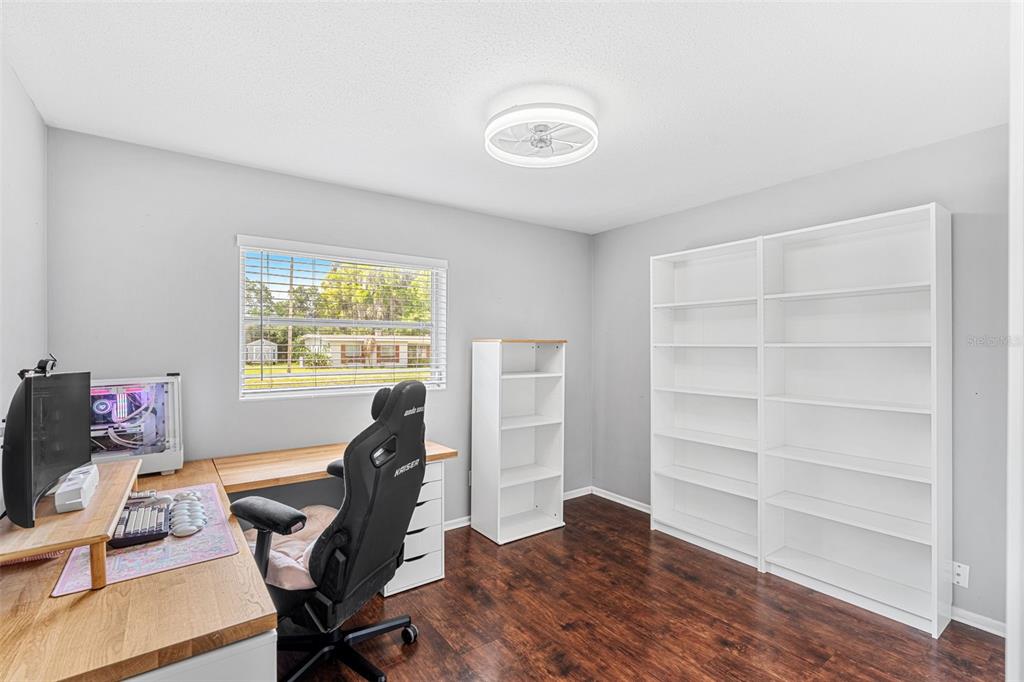 2923 Conway Gardens Road Orlando, FL 32806 - Photo 16 of 28 a workspace with furniture and a window