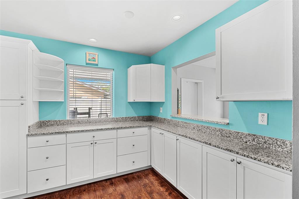 2923 Conway Gardens Road Orlando, FL 32806 - Photo 20 of 28 a kitchen with sink and cabinets
