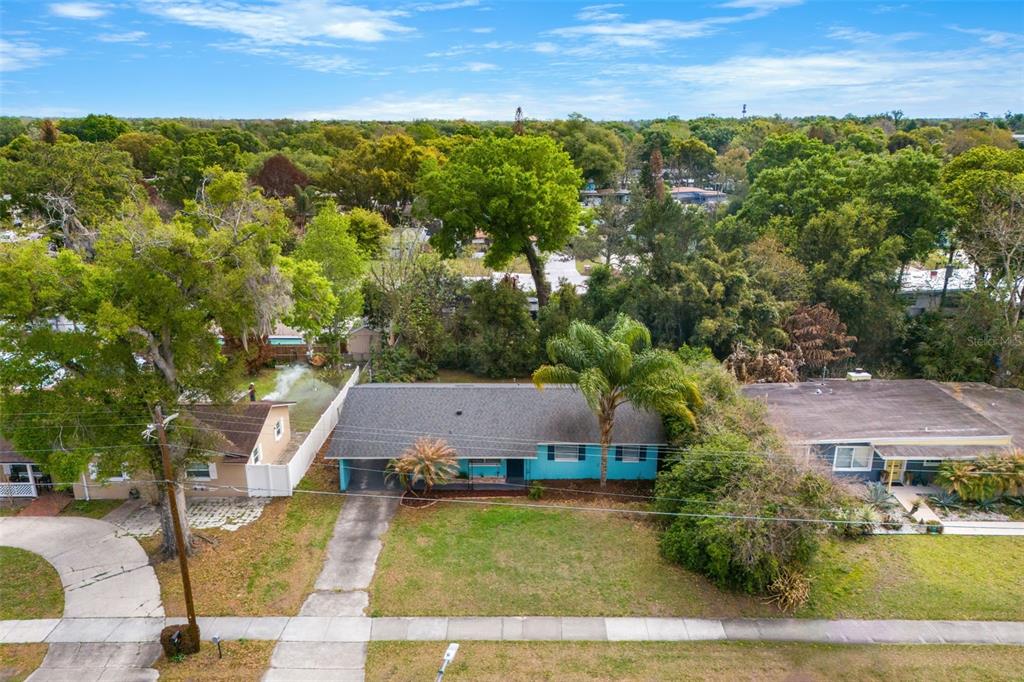 2923 Conway Gardens Road Orlando, FL 32806 - Photo 3 of 28 an aerial view of residential houses with outdoor space and trees