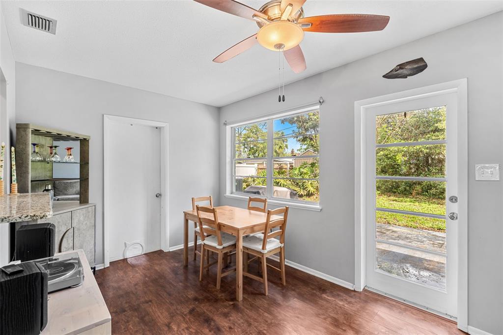 2923 Conway Gardens Road Orlando, FL 32806 - Photo 9 of 28 a dining room with furniture and window