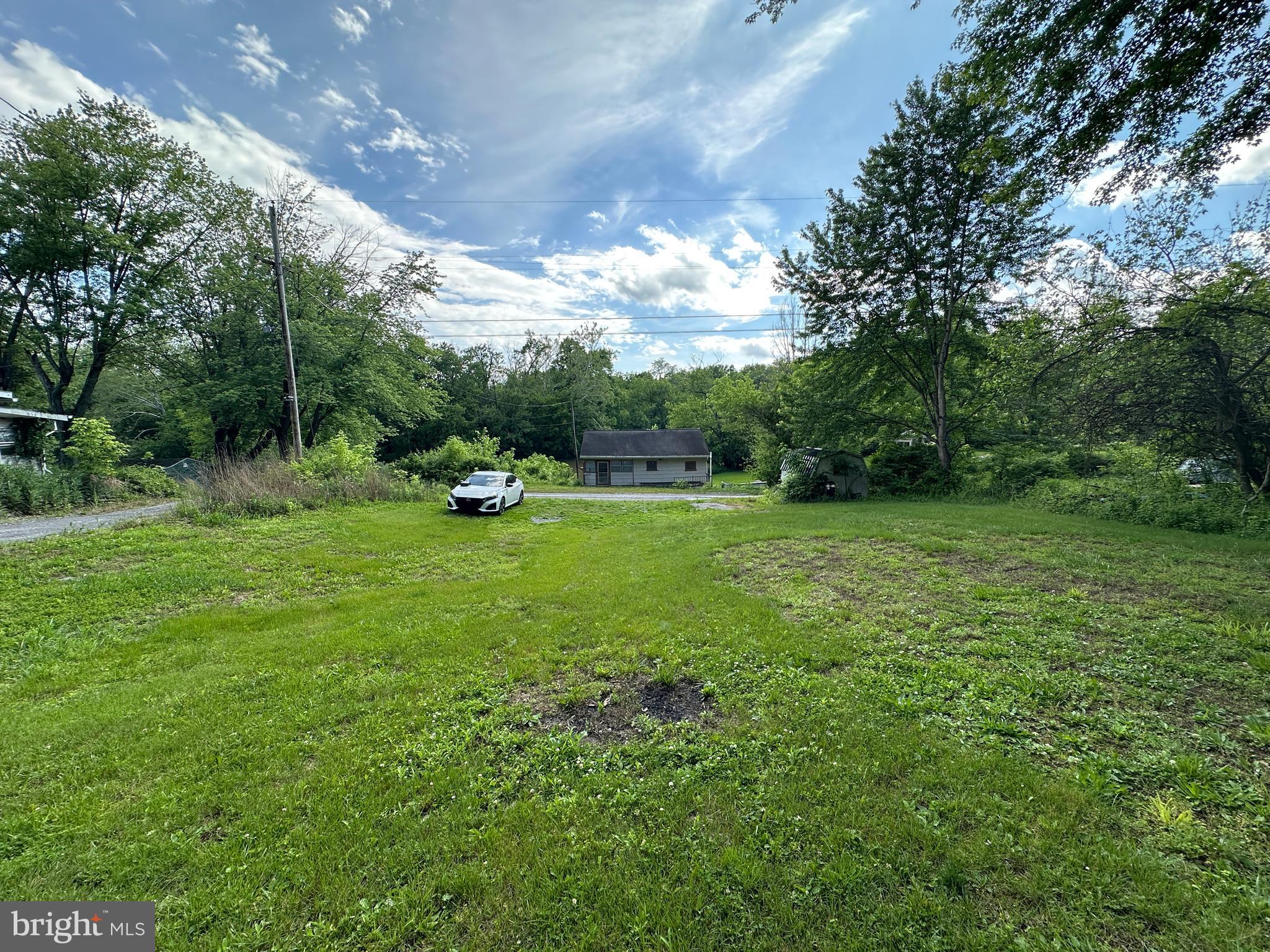 13726 Hopps Landing Road Hagerstown, MD 21740 - Photo 56 of 71 a view of outdoor space with green field and trees