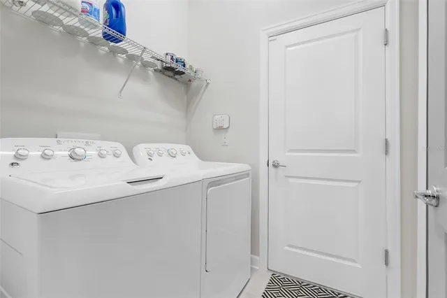 a utility room with dryer and washer