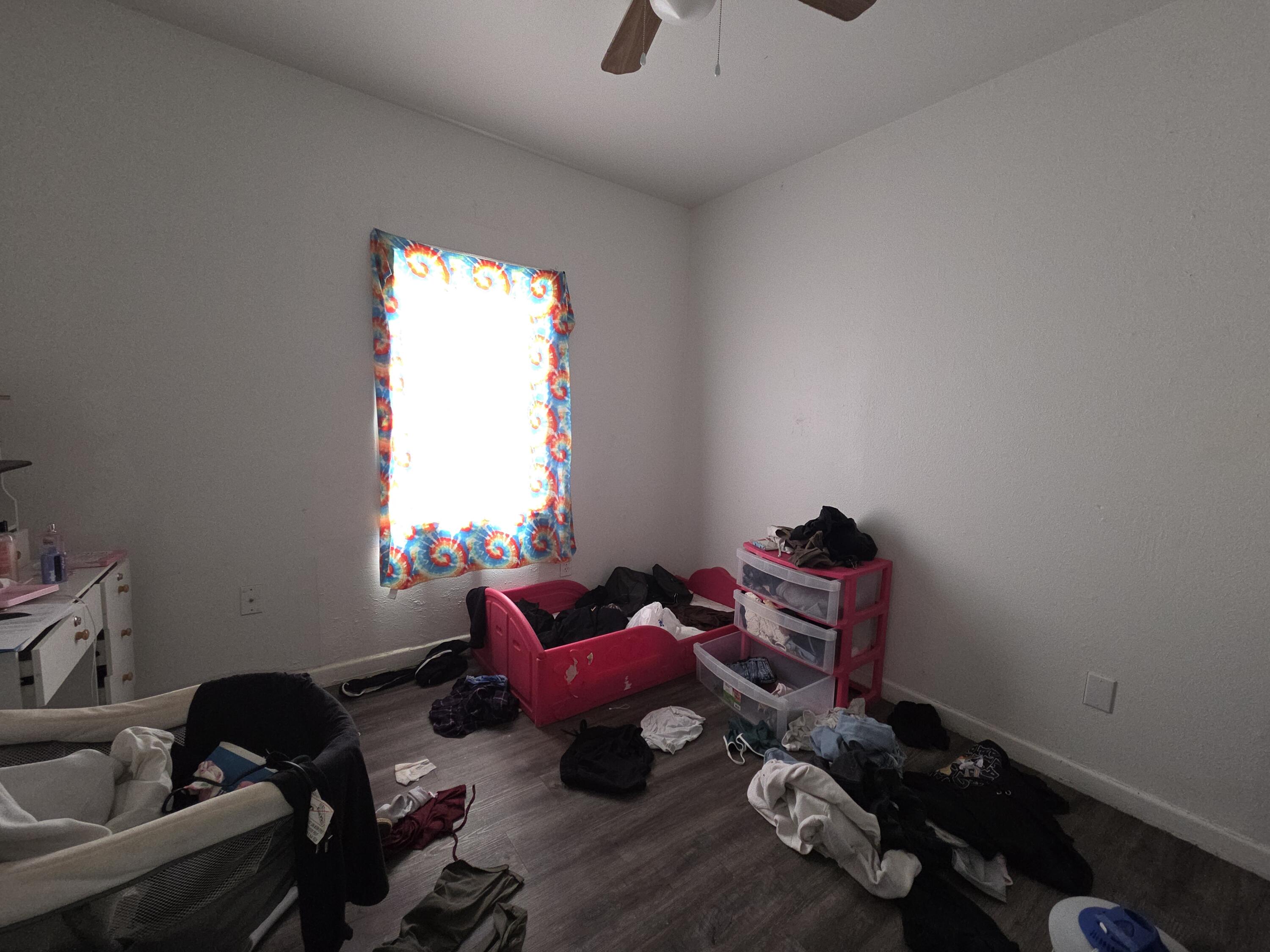 2401 East 10th Street Lubbock, TX 79403 - Photo 7 of 7 a room with furniture toys and a window