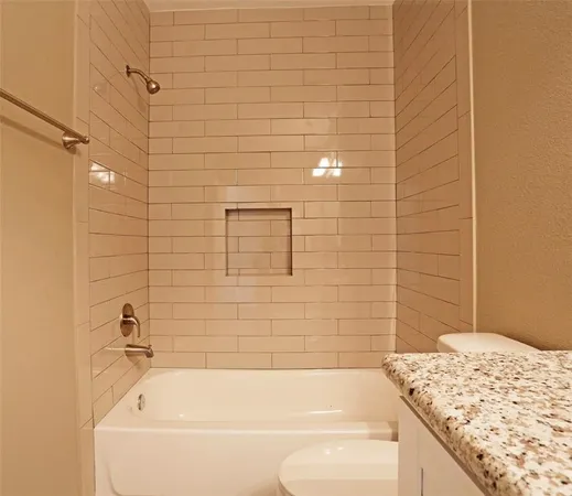 a bathroom with a bathtub and shower
