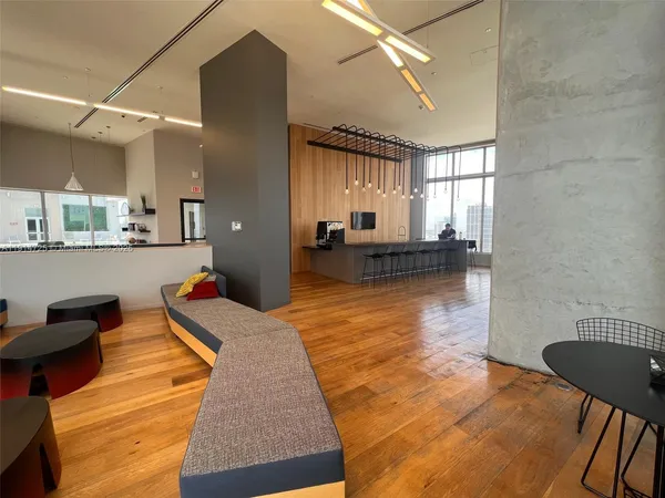 a lobby with furniture and rug