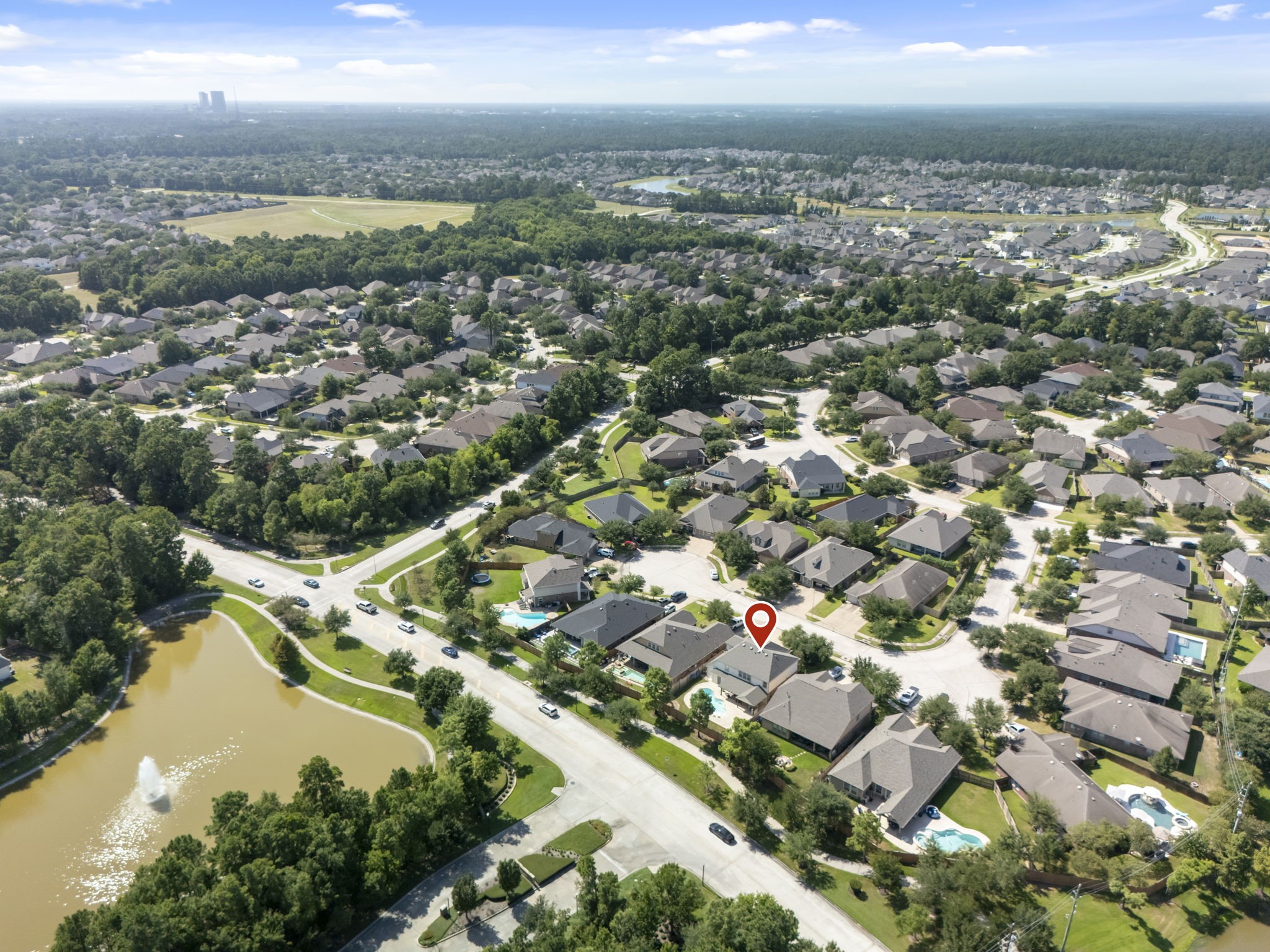 3318 Solvista High Court Spring, TX 77386 - Photo 32 of 33 Aerial perspective showcases the home's location near scenic lakes, walking trails, parks, and neighborhood green spaces, all within a well-established community with convenient access to everyday amenities.
